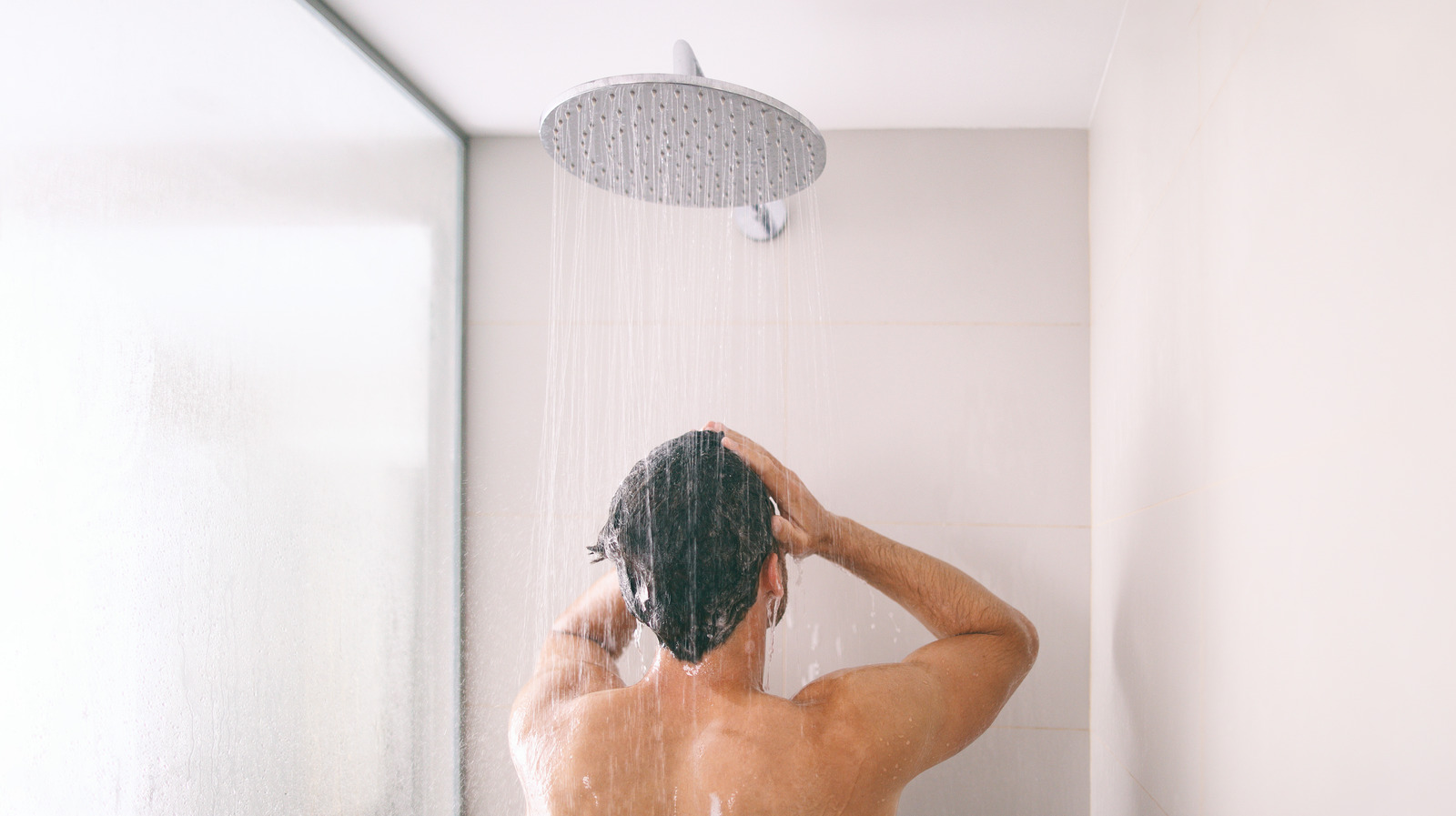 Cock sprayed with shower head image
