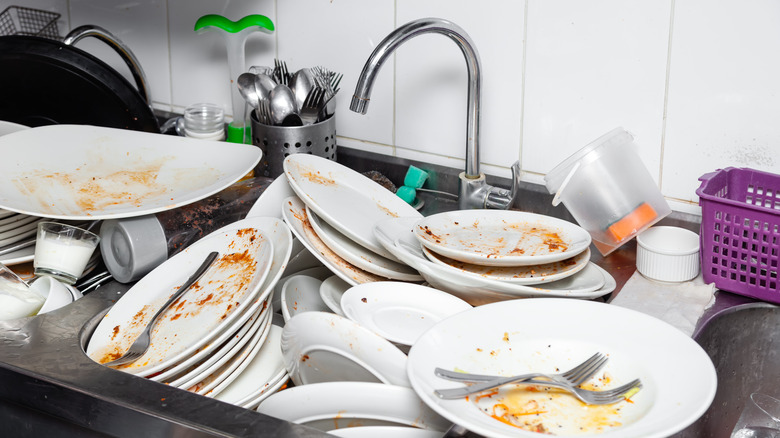 sink filled with dirty dishes