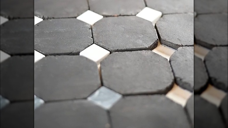 Terracotta backsplash tiles in a rounded square shape