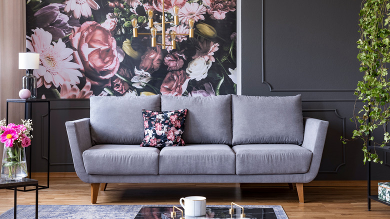 sofa with floral throw pillow