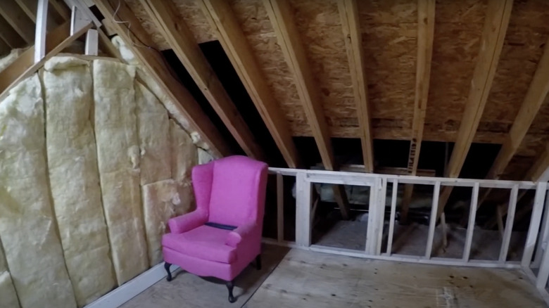 pink chair in attic