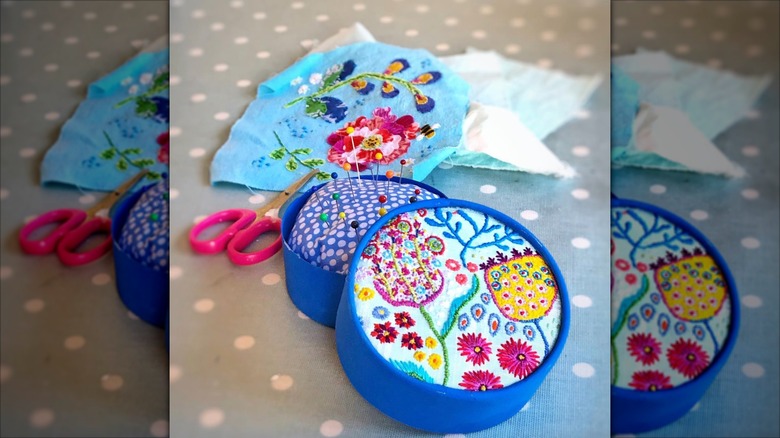 Embroidered portable pincushion made from cheese box