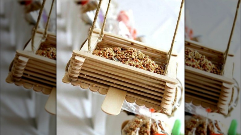 swinging popsicle stick bird feeder