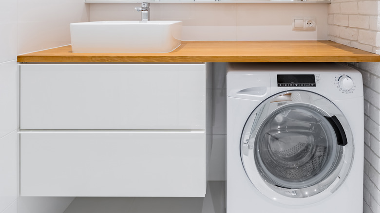 built-in drawers next to laundry machine 