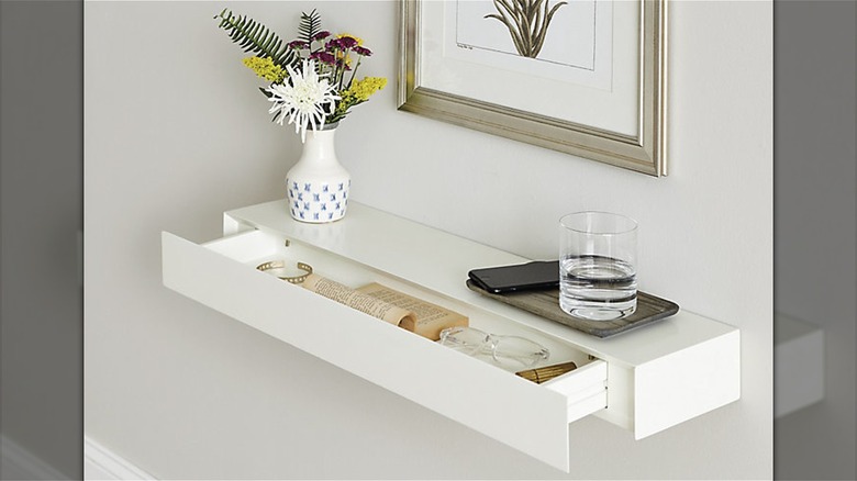 white floating shelf with drawer