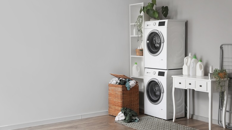 laundry room with stacked washer dryer