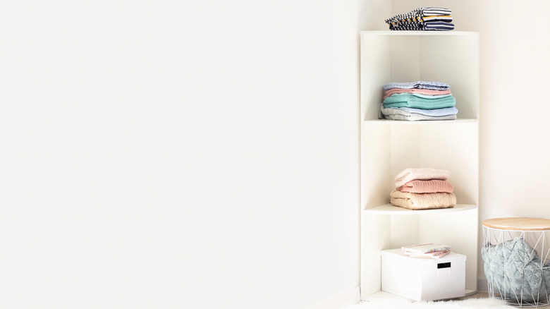 corner shelf with clothing