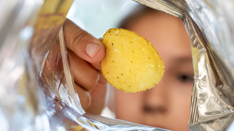 Almost empty potato chip bag.