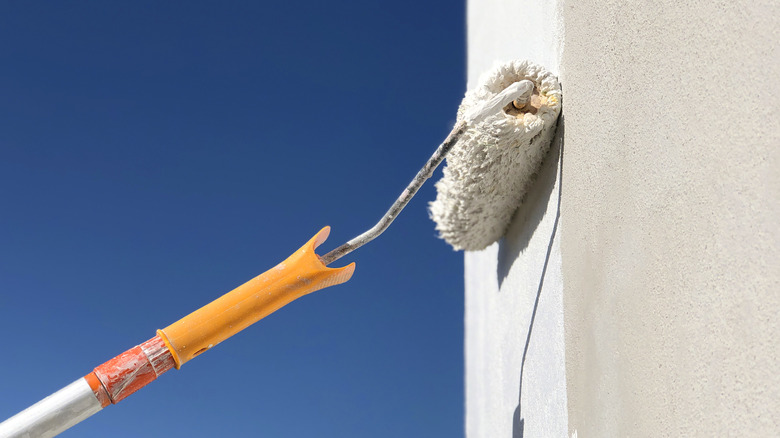 white paint roller on exterior