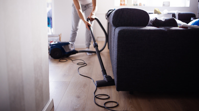 woman vacuuming living room