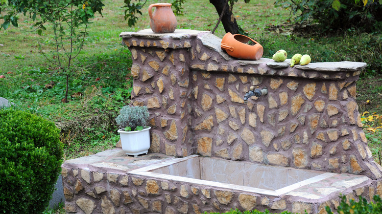 large washbasin surrounded by stones