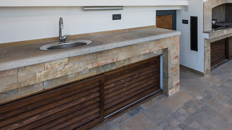 stone and wooden round sink