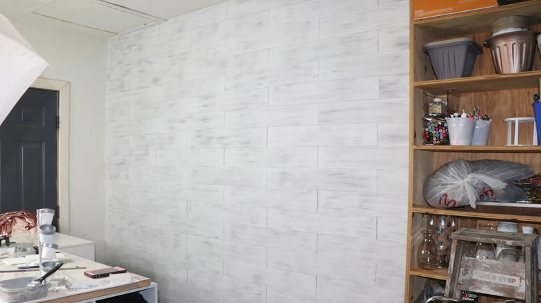 A white shiplap accent wall in a home