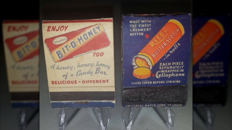 Vintage matchbooks advertising candy propped on tiny plastic easels