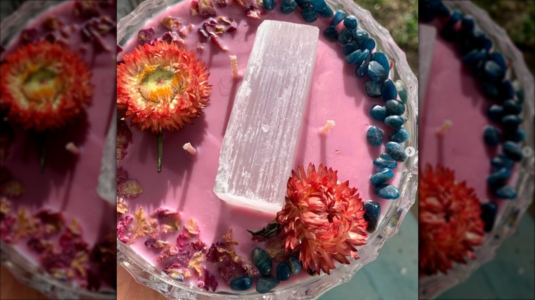 Handmade pink candle in vintage dish