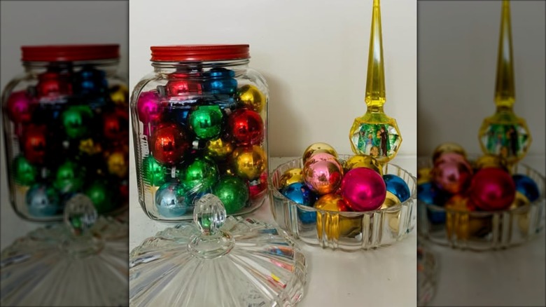 Glass holiday ornaments in jar and candy dish