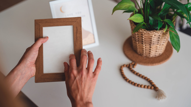 hands holding picture frame