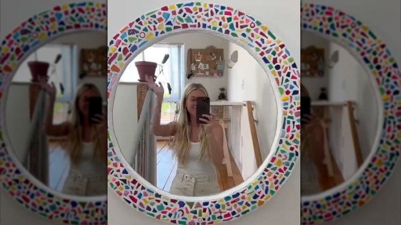 mirror decorated with plastic trash