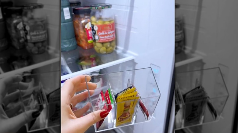 a clear storage cup with condiment packets