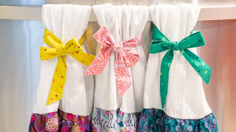 Kitchen towels with bows to keep them in place