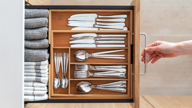 Kitchen towels neatly arranged in silverware drawer