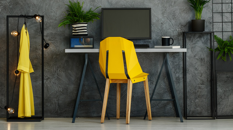 Grey textured wall with desk