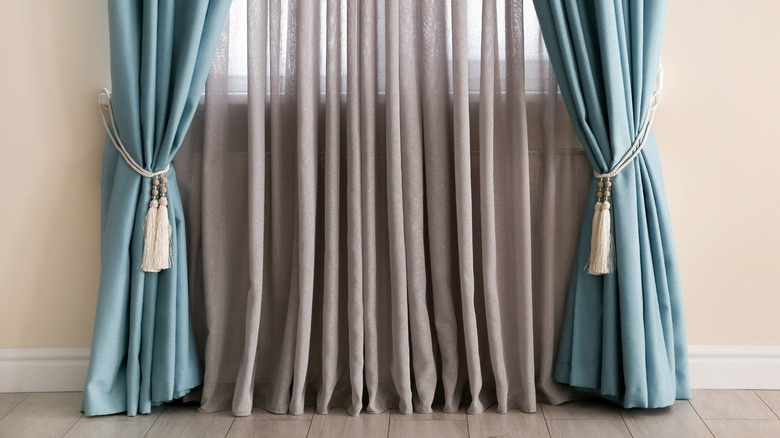 blue curtains with tassels