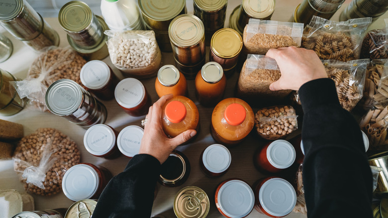 person organizing pantry items