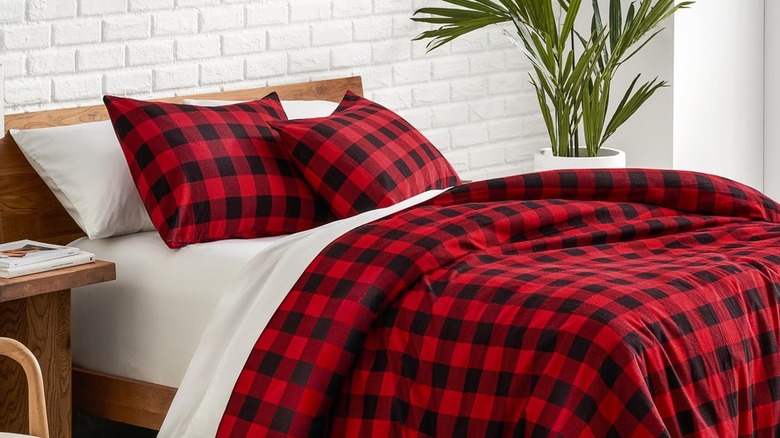 A red and black plaid flannel duvet cover on a bed