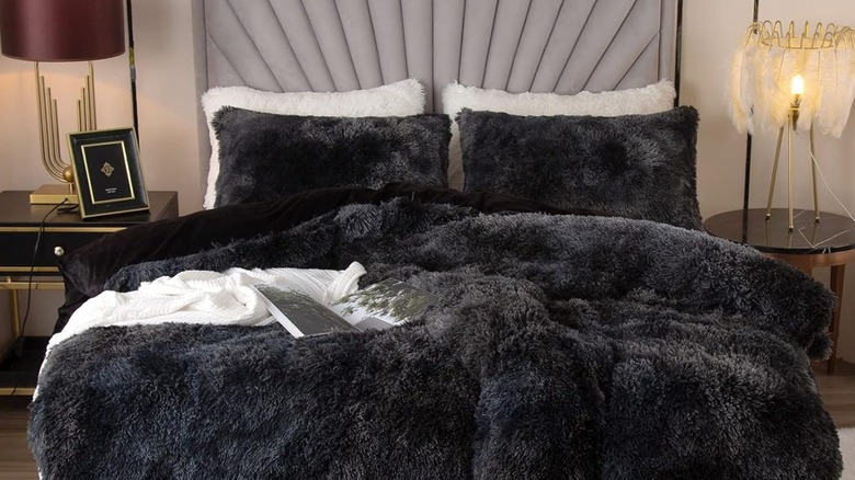 A fuzzy dark gray duvet cover on a bed