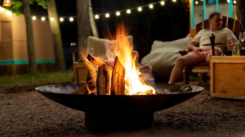 rustic bonfire pit burning at night