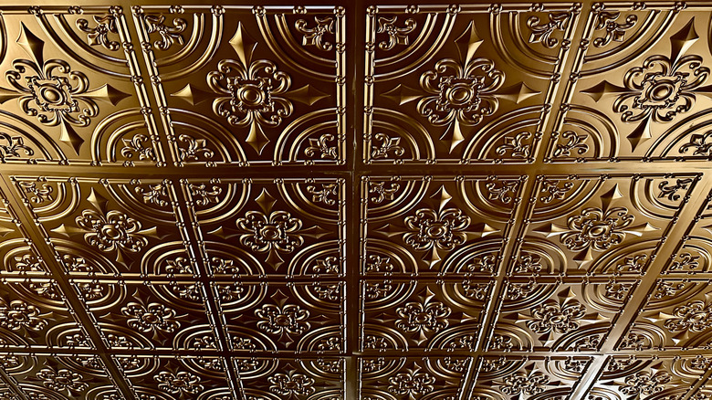 Gold painted tin ceiling panel tiles.