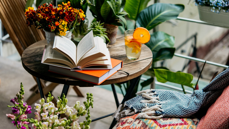 Books and flowers on table