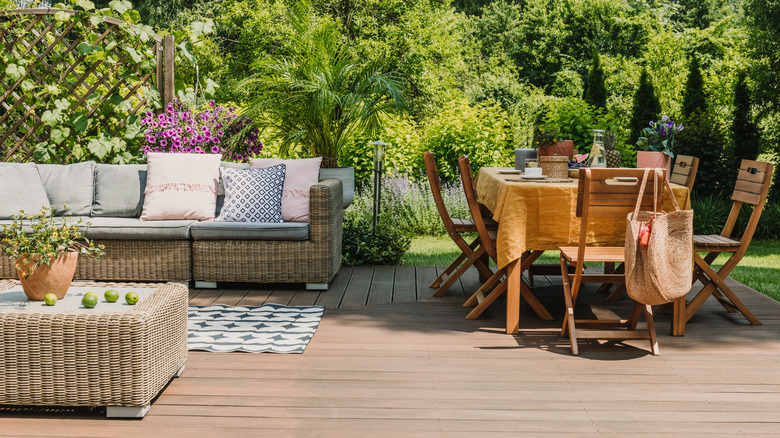 patio with outdoor dining and couch