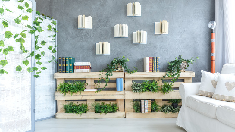 living room with wooden pallet bookshelves