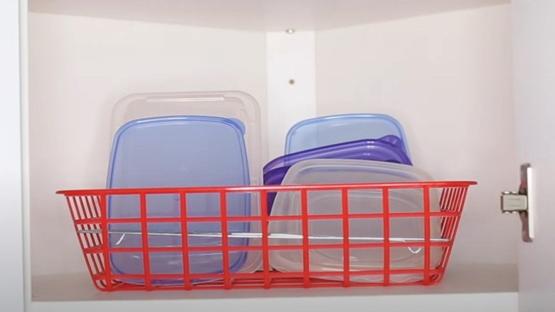 Plastic lids stored in a wire cooling rack and basket