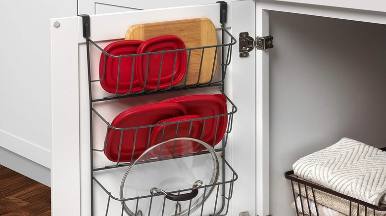 An over-the-door cabinet organizer with plastic lids