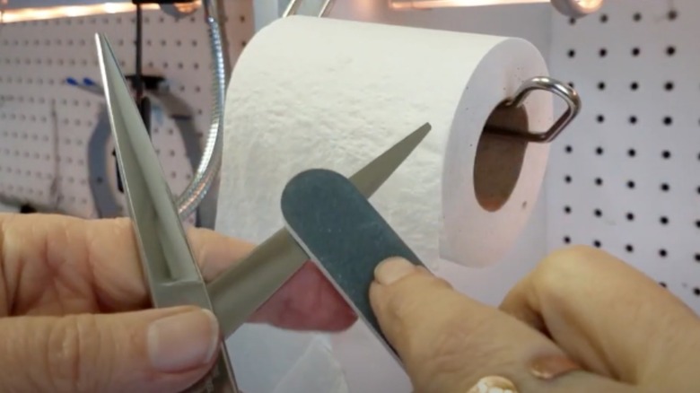 buffing scissor blades with nail file