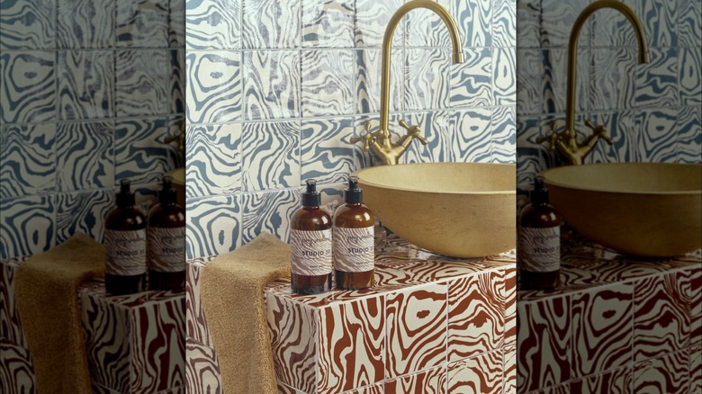 Bathroom vanity with animal-print glazed ceramic tiles