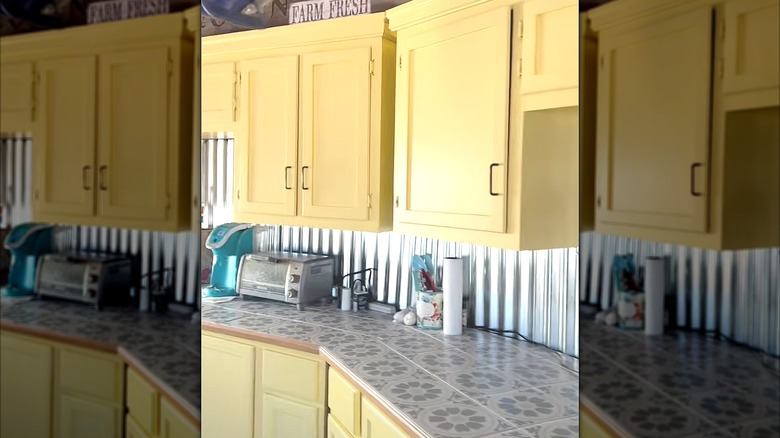 Kitchen with mosaic tile countertops and yellow cabinets