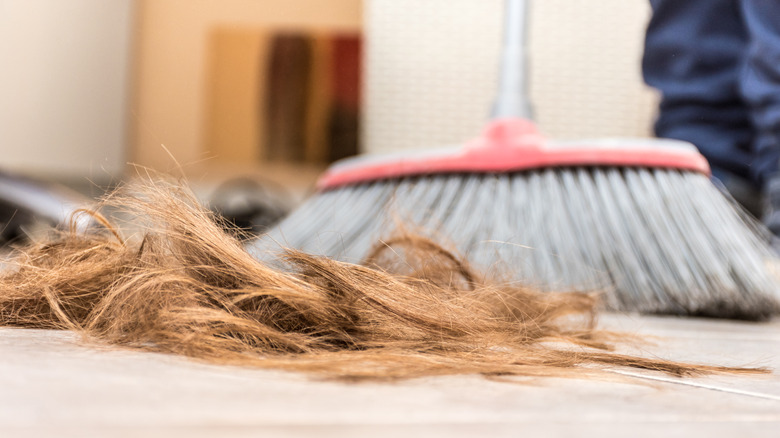 Sweeping hair salon floor