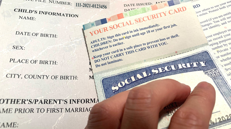 hand covering social security card