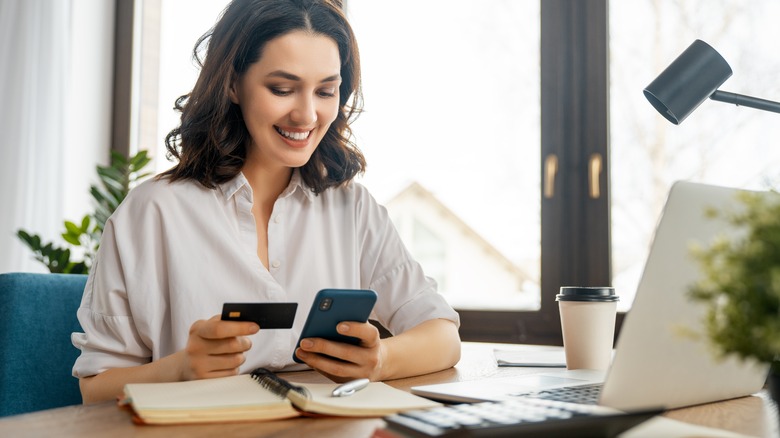 woman credit card phone