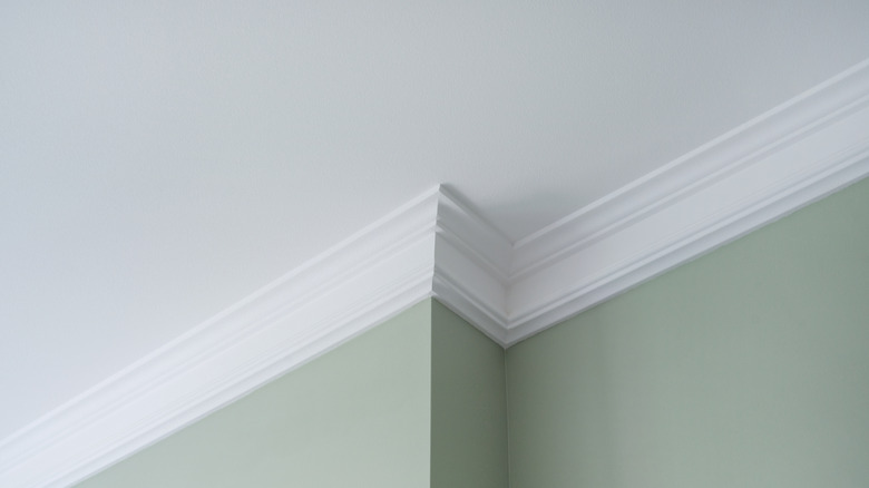 Green walls with white crown molding