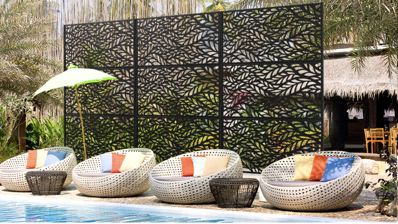 Black metal decorative screen near swimming pool