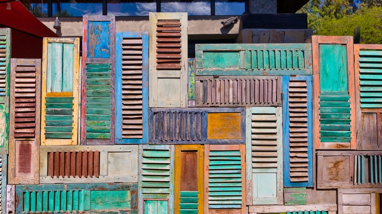 colorful shutters crated into a wall