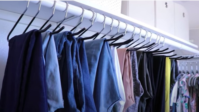 Organized jeans hanging in closet