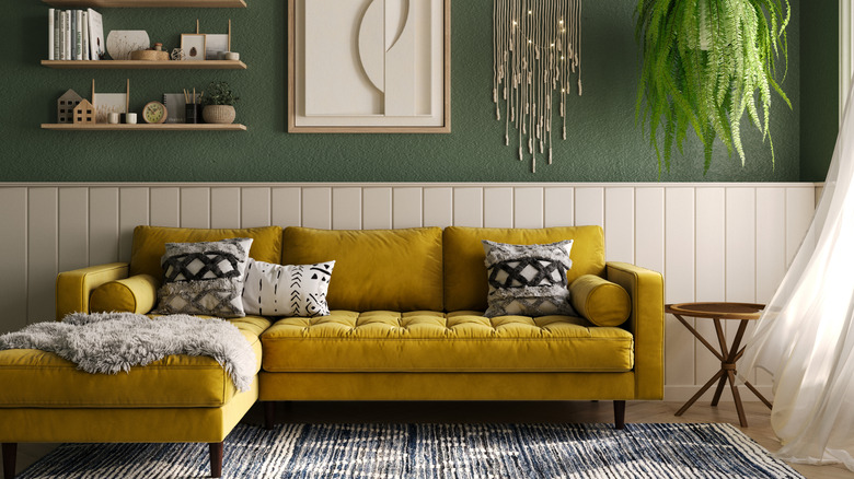 Living room with gold velvet couch.