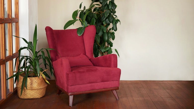 magenta armchair with plants