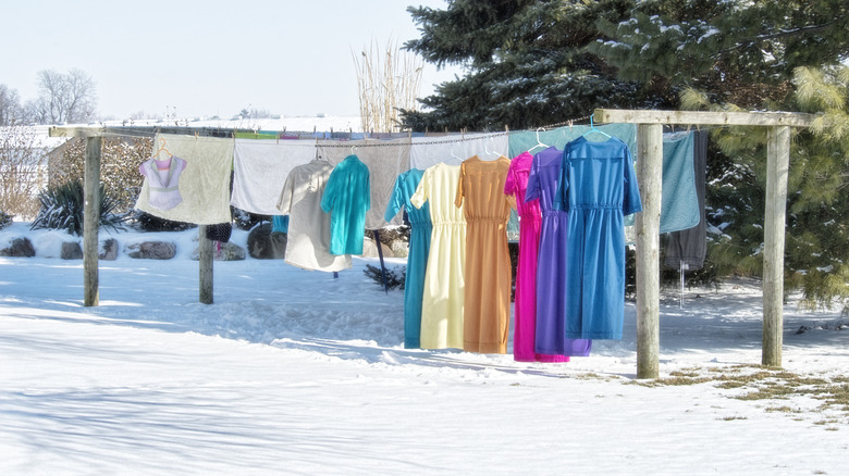 Laundry drying outside against a snowy backdrop